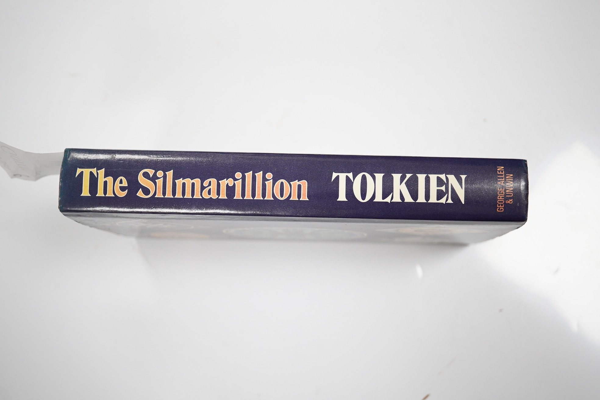 Tolkien, J.R.R. The Silmarillion. Edited by Christopher Tolkien. First Edition. large folded and coloured pictorial map, title within decorated borders; publisher's gilt cloth and d/wrapper. George Allen & Unwin, 1977